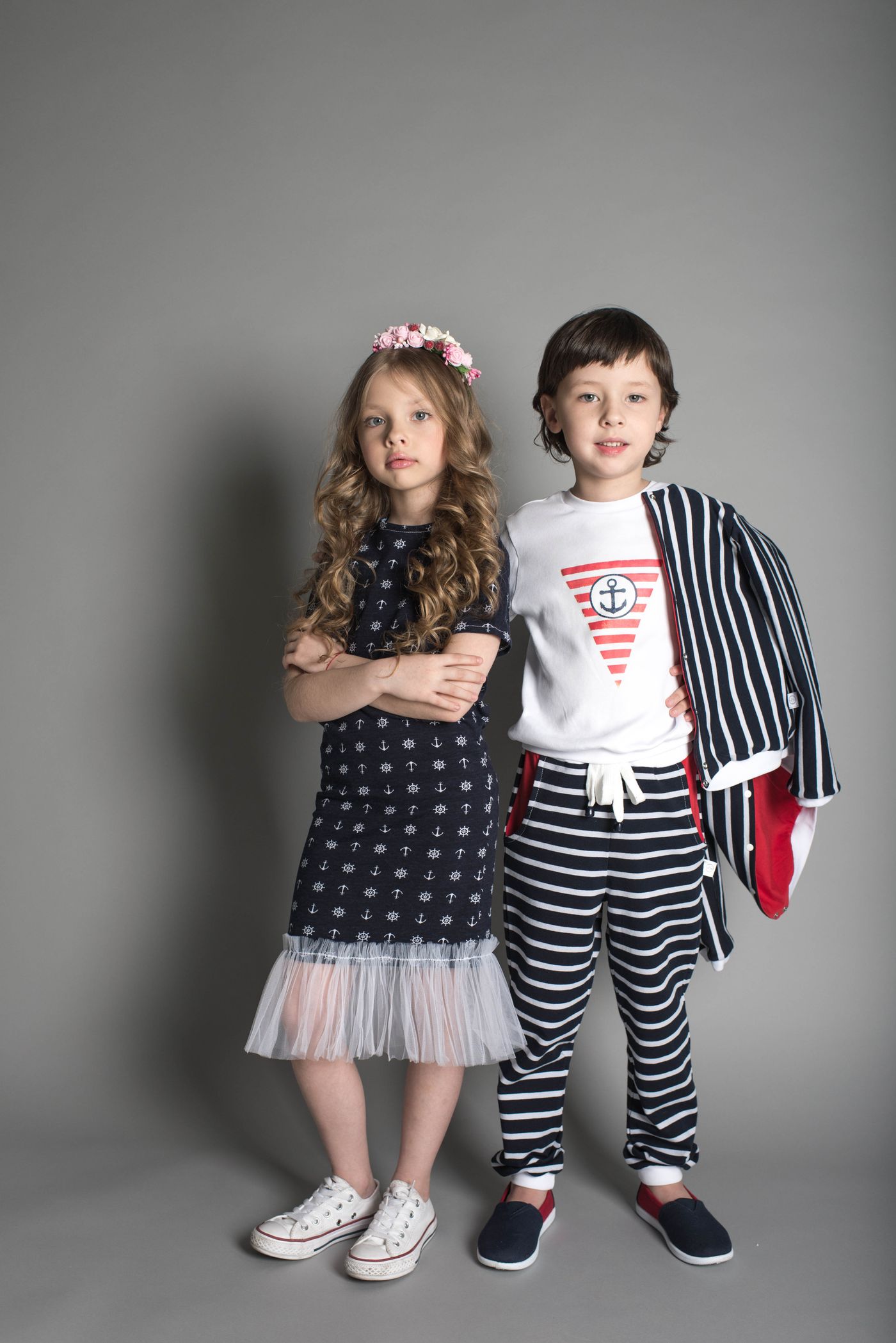 Two kids wearing coordinated nautical outfits